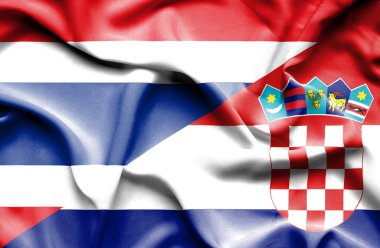 Hırvatistan ve Tayland bayrağı sallayarak