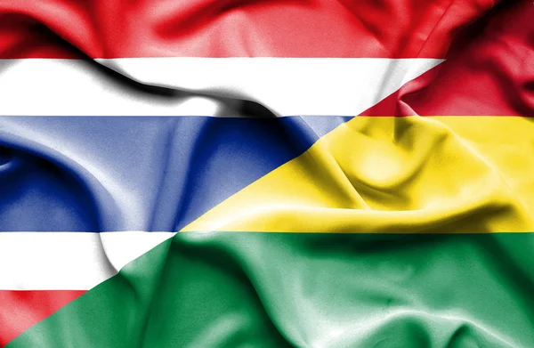 Waving flag of Bolivia and Thailand — Stock Photo, Image