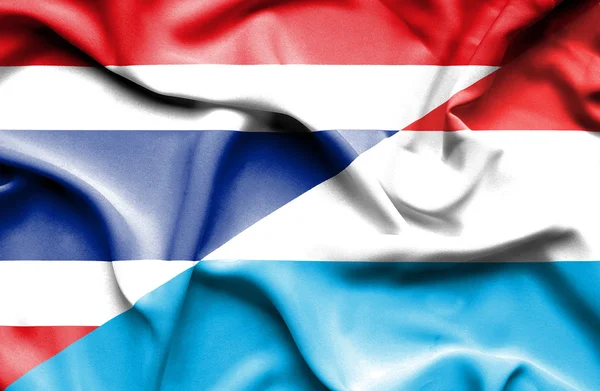 Bandeira ondulada do Luxemburgo e da Tailândia — Fotografia de Stock