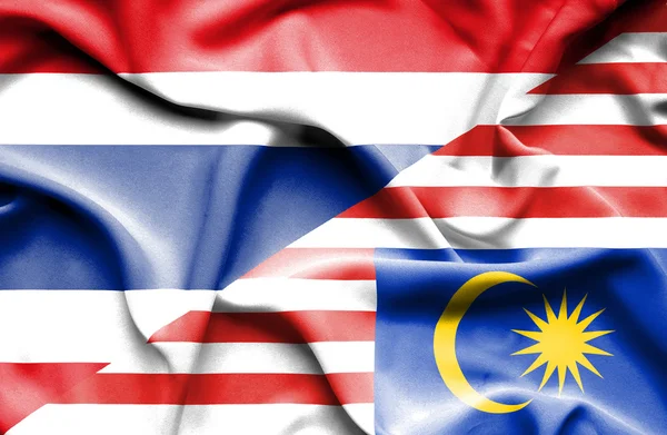 Waving flag of Malaysia and Thailand — Stock Photo, Image