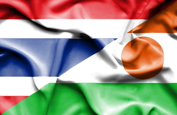 Vlající vlajka Nigeru a Thajska — Stock fotografie