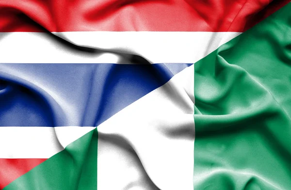 Wapperende vlag van nigeria en thailand — Stockfoto