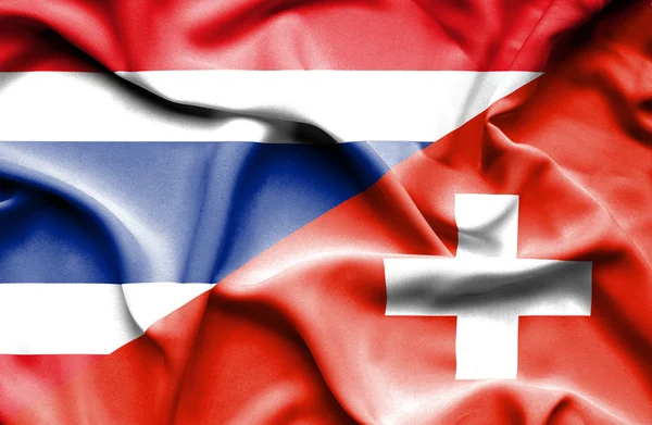 スイス連邦共和国およびタイの旗を振っています。 — ストック写真