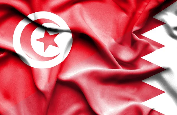 Waving flag of Bahrain and Tunisia — Stock Photo, Image