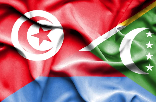 Waving flag of Comoros and Tunisia — Stock Photo, Image