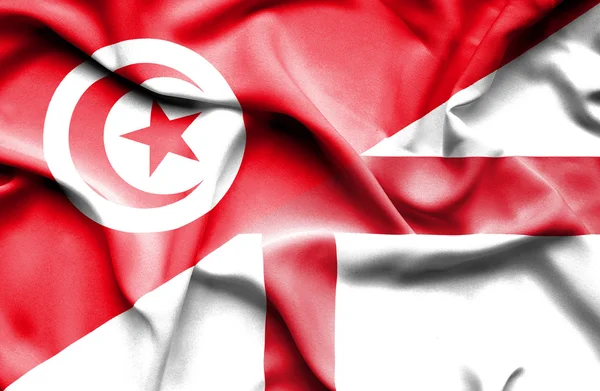 Waving flag of England and Tunisia — Stock Photo, Image