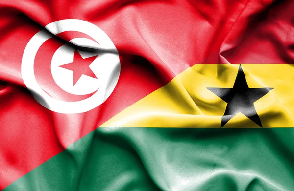 Waving flag of Ghana and Tunisia — Stock Photo, Image