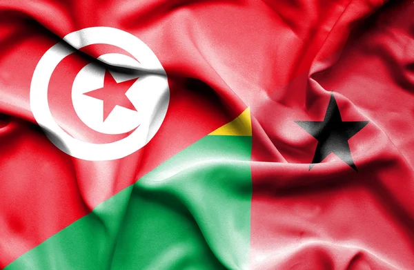 Wapperende vlag van Guinee-bissau en Tunesië — Stockfoto