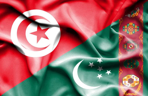 Wapperende vlag van turkmenistan en Tunesië — Stockfoto