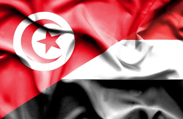 Waving flag of Yemen and Tunisia — Stock Photo, Image