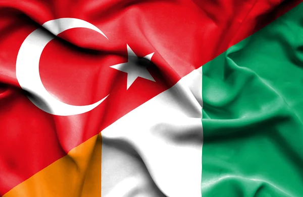 Waving flag of Ivory Coast and Turkey — Stock Photo, Image