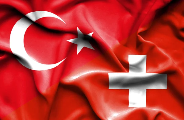 Viftande flagga Schweiz och Turkiet — Stockfoto