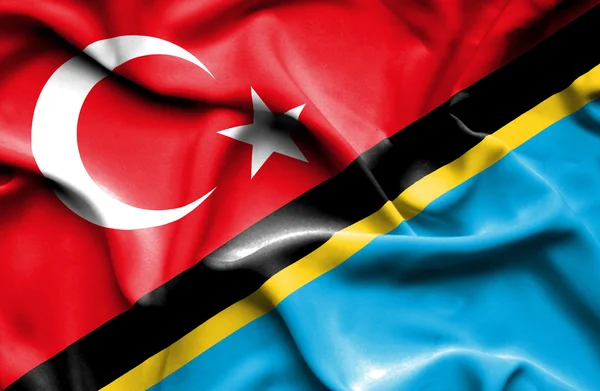 Waving flag of Tanzania and Turkey