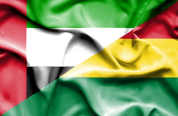 Flagge von Bolivien und vereinten arabischen Emiraten geschwenkt — Stockfoto