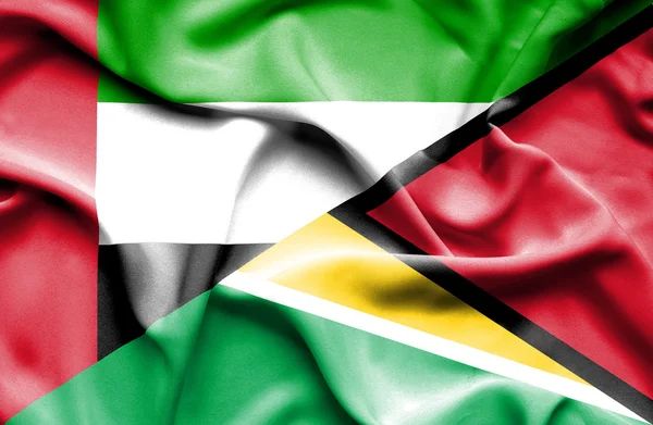 Waving flag of Guyana and United Arab Emirates — Stock Photo, Image