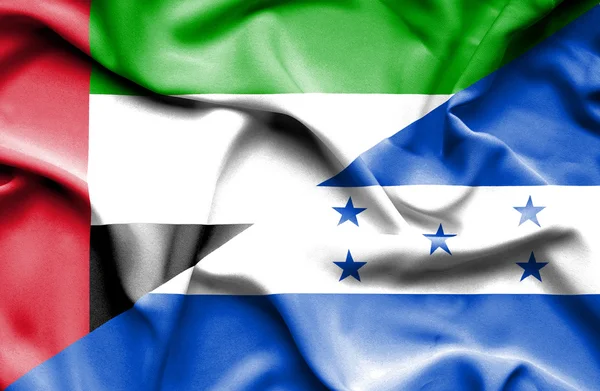 Waving flag of Honduras and United Arab Emirates — Stock Photo, Image
