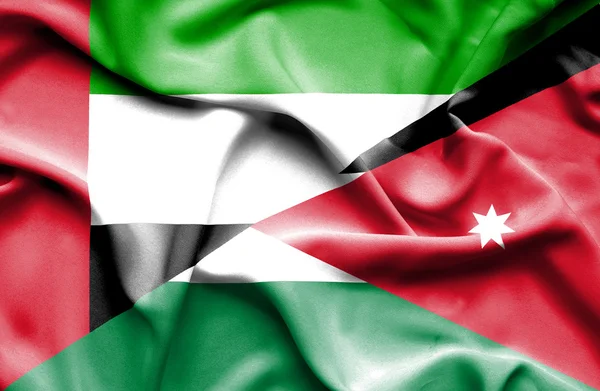 Vlající vlajka Jordánska a Spojené arabské emiráty — Stock fotografie