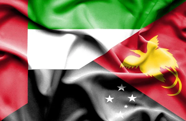 Bandera ondeante de Papúa Nueva Guinea y Emiratos Árabes Unidos —  Fotos de Stock