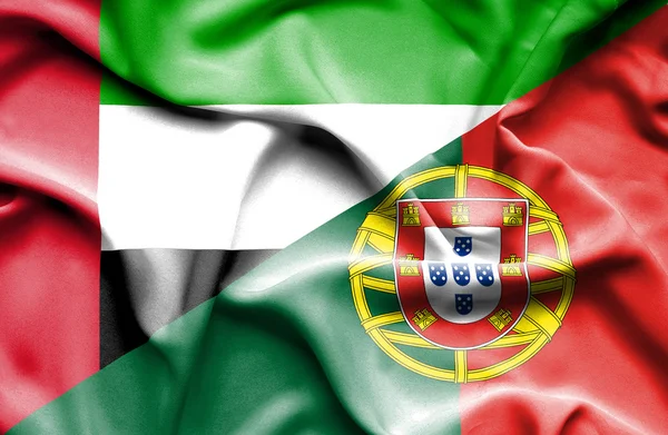 Waving flag of Portugal and United Arab Emirates — Stock Photo, Image