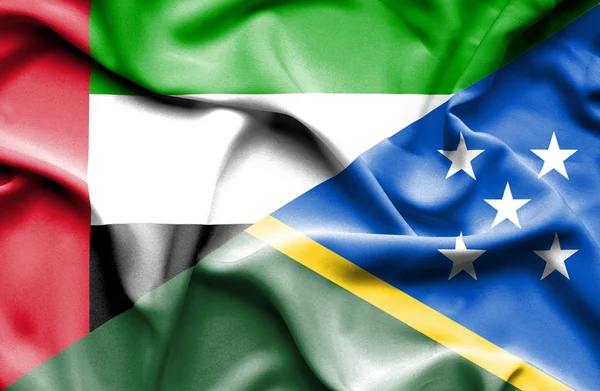 Waving flag of Solomon Islands and United Arab Emirates — Stock Photo, Image