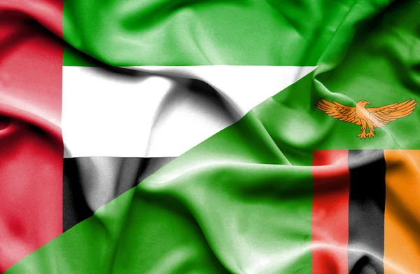 Waving flag of Zimbabwe and United Arab Emirates — Stock Photo, Image