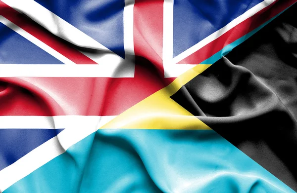 Waving flag of Bahamas and Great Britain — Stock Photo, Image