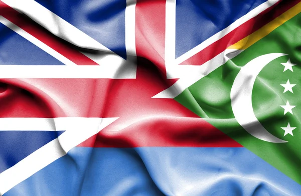 Waving flag of Comoros and Great Britain — Stock Photo, Image