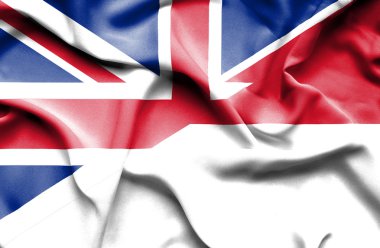Endonezya ve Büyük Britanya bayrağı sallayarak