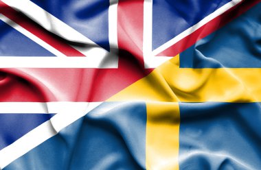 İsveç ve Büyük Britanya bayrağı sallayarak