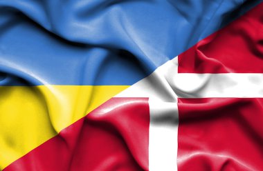 Waving flag of Denmark and Ukraine