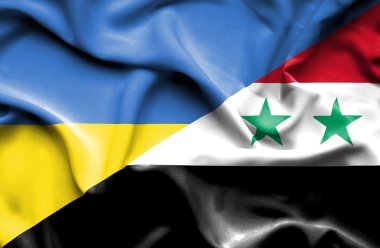 Suriye ve Ukrayna bayrağı sallayarak