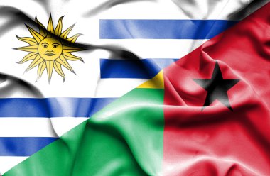 Waving flag of Guinea Bissau and Uruguay