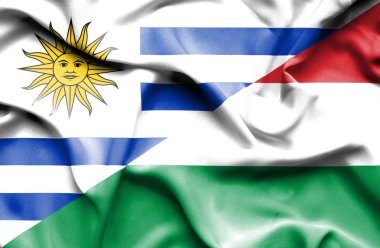 Waving flag of Hungary and Uruguay