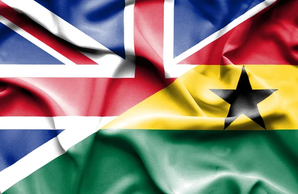 Waving flag of Ghana and Great Britain — Stock Photo, Image