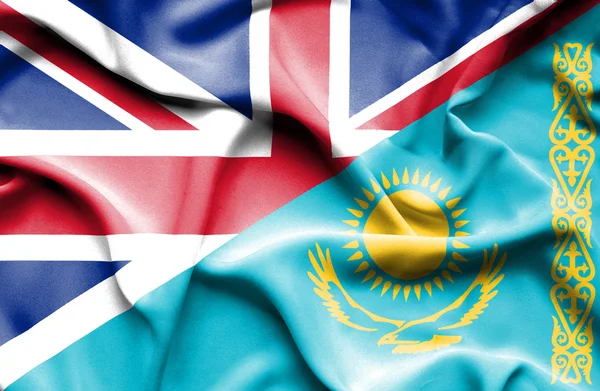 Waving flag of Kazakhstan and Great Britain — Stock Photo, Image