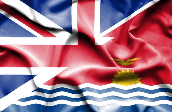 Vlající vlajka kiribati a Velké Británie — Stock fotografie