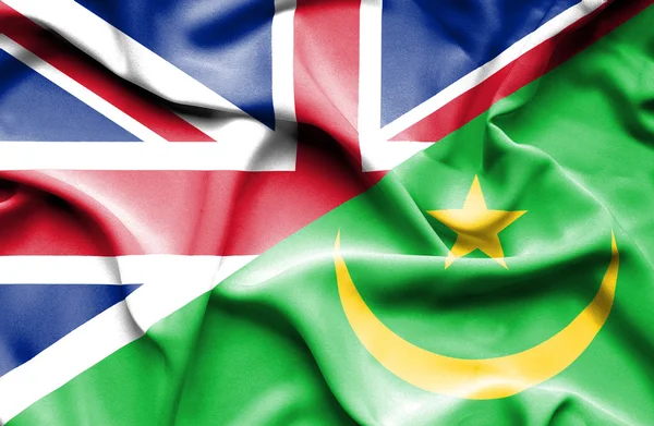 Waving flag of Mauritania and Great Britain — Stock Photo, Image