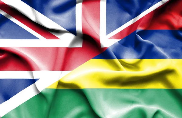 Waving flag of Mauritius and Great Britain — Stock Photo, Image