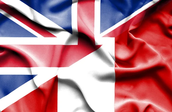 Waving flag of Peru and Great Britain — Stock Photo, Image