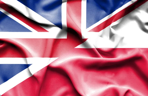 Waving flag of Poland and Great Britain — Stok fotoğraf