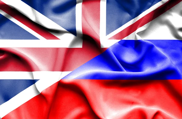 Waving flag of Russia and Great Britain — Stockfoto