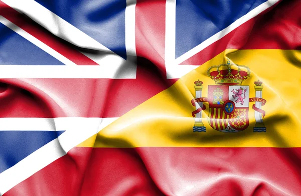 Waving flag of Spain and Great Britain — Stock fotografie