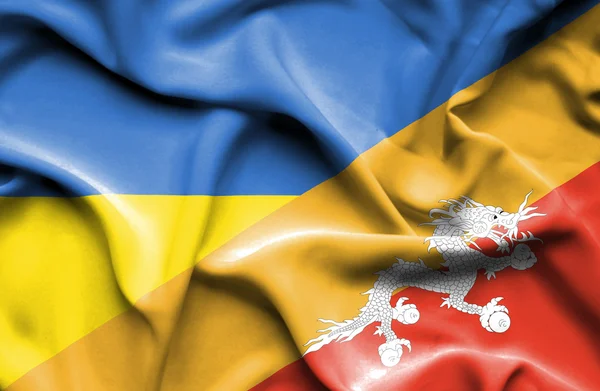 Vlající vlajka Bhútánu a Ukrajiny — Stock fotografie