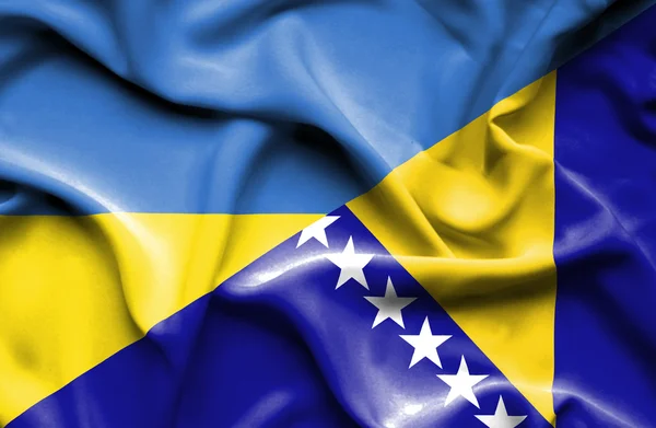 Flagge von Bosnien und Herzegowina und der Ukraine schwenken — Stockfoto
