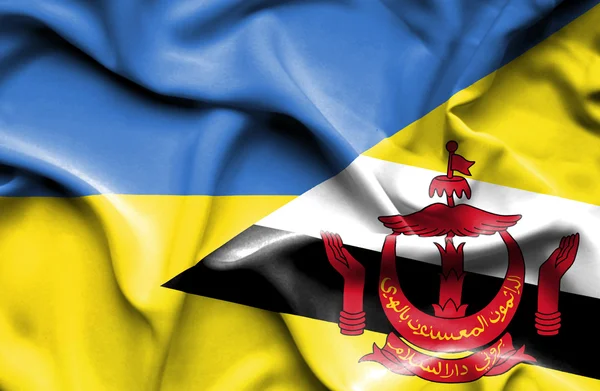 Waving flag of Brunei and Ukraine — Stock Photo, Image