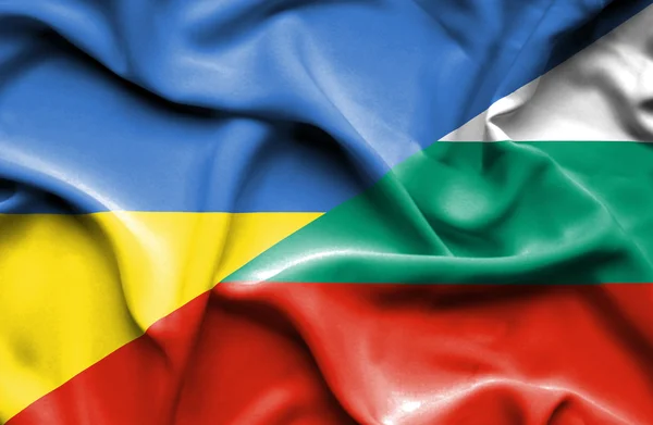 Waving flag of Bulgaria and Ukraine — Stok fotoğraf