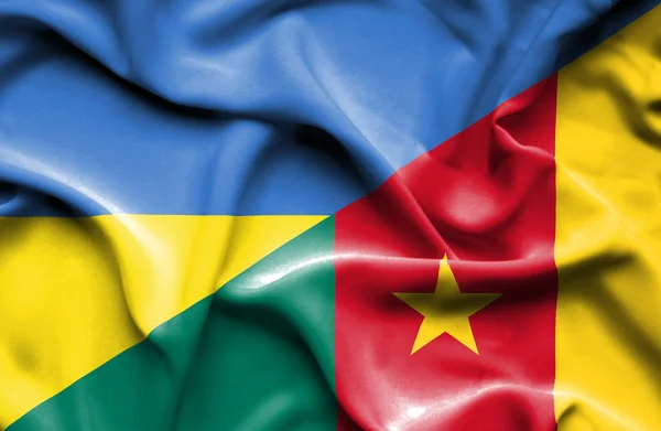 Waving flag of Cameroon and Ukraine — Stockfoto