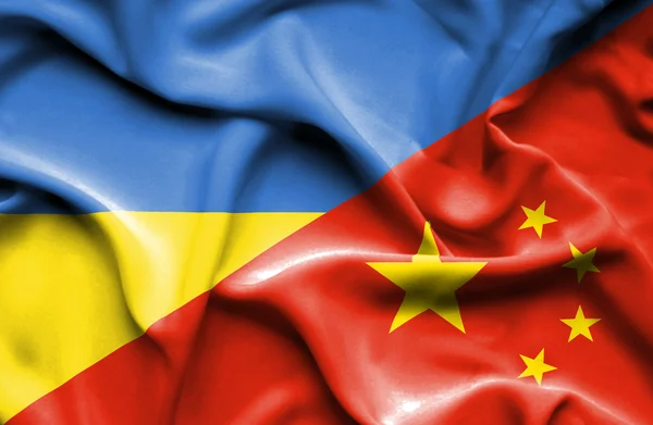 Waving flag of China and Ukraine — Stok fotoğraf