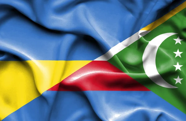 Waving flag of Comoros and Ukraine — Stock Photo, Image