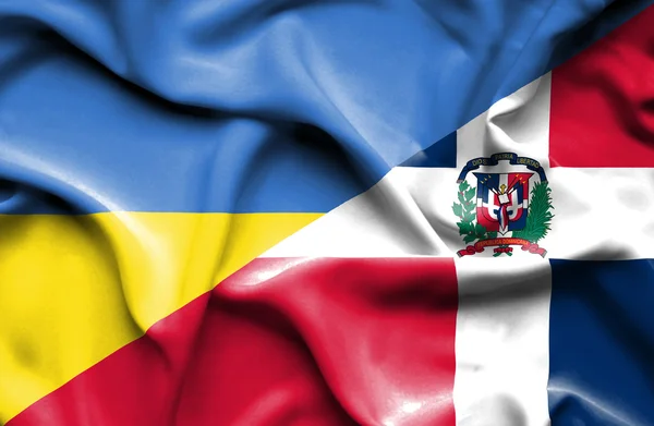 Waving flag of Dominican Republic and Ukraine — Stock fotografie